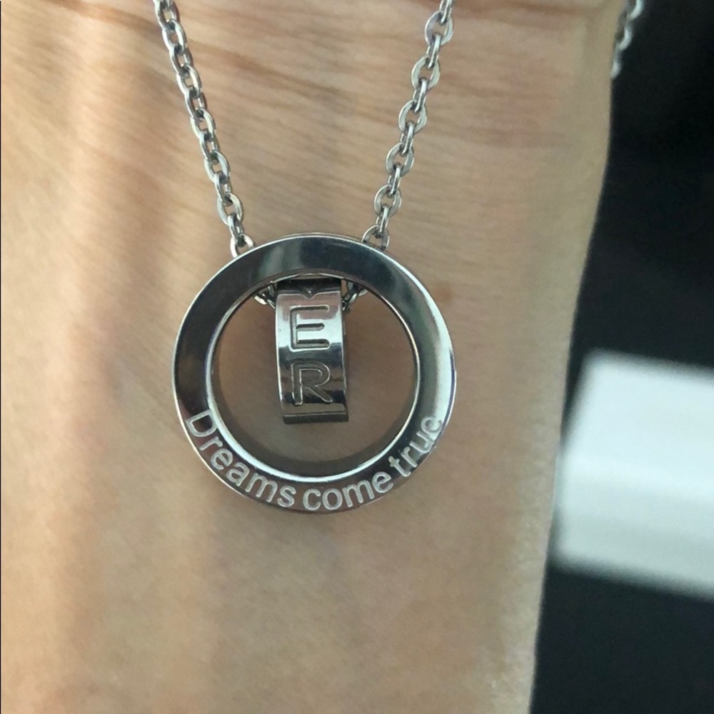 Silver necklace with engraved circular charms